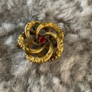 Antique Gold design is known as “love knot” or Celtic-inspired swirl motif